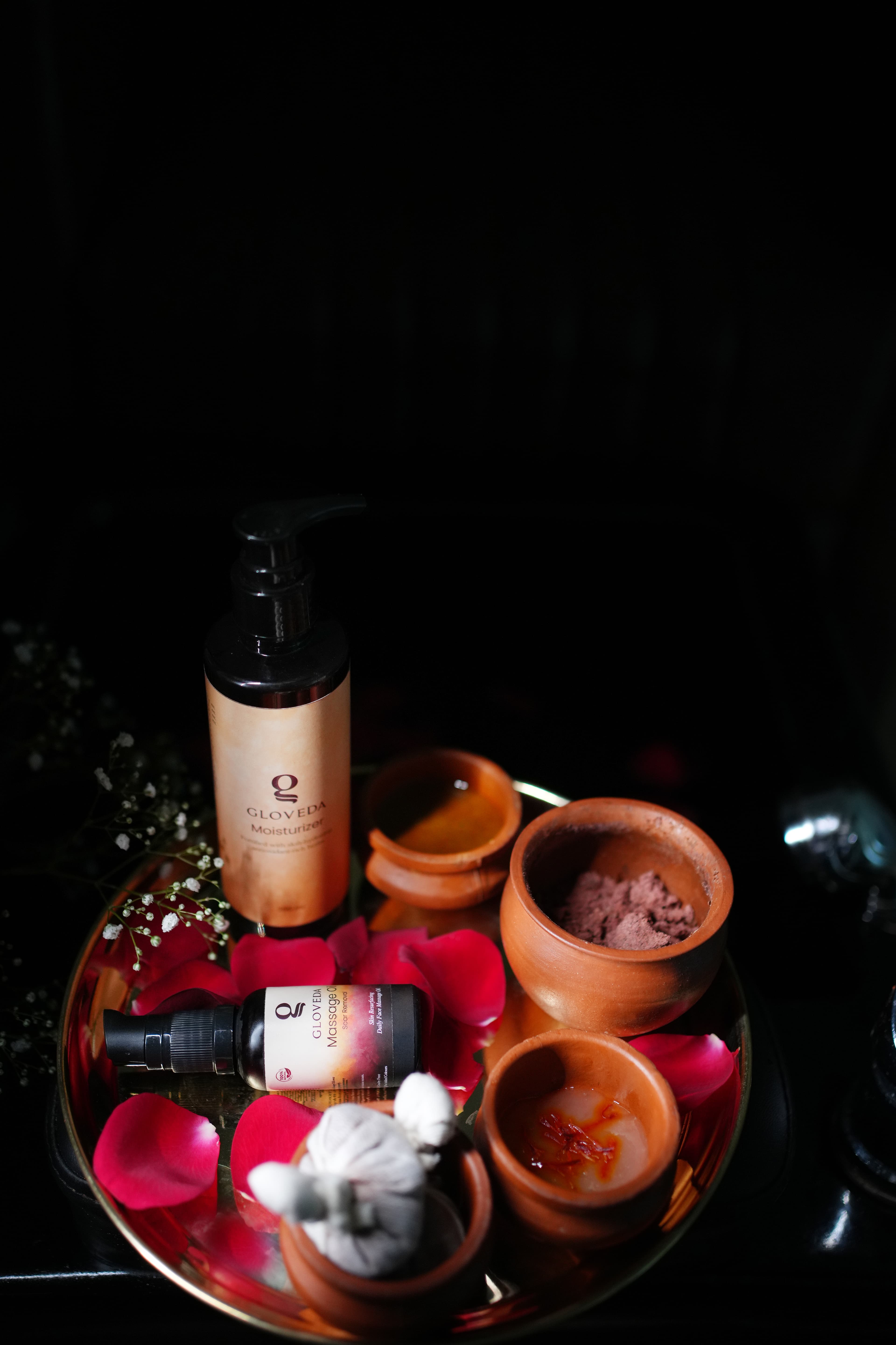 Gloveda signature Ayurvedic products with rose petals